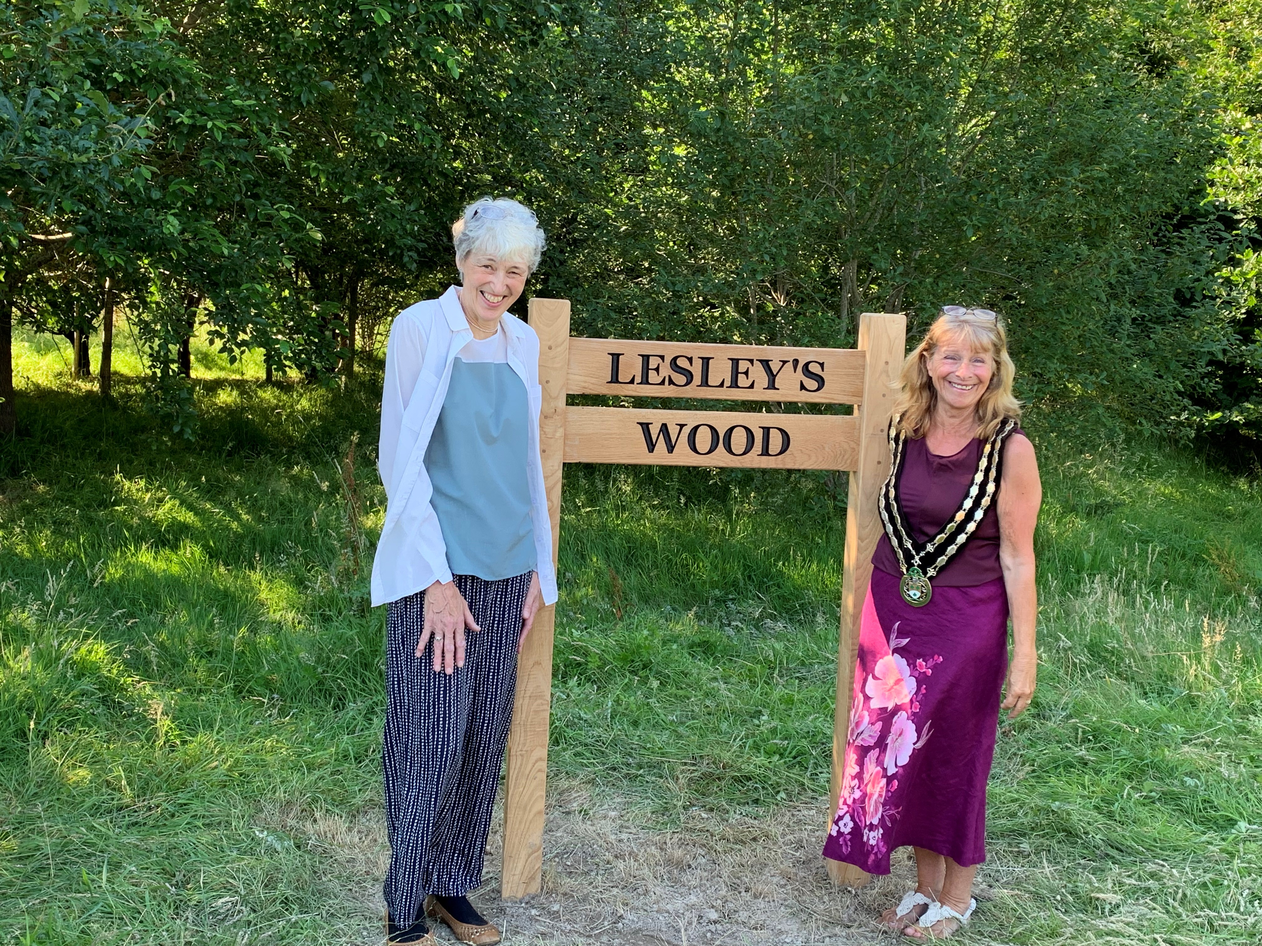Photo of the Town Mayor and Lesley Hughes with the new sign for the woods